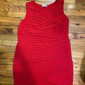 Form fitting red cocktail dress by Calvin Klein.